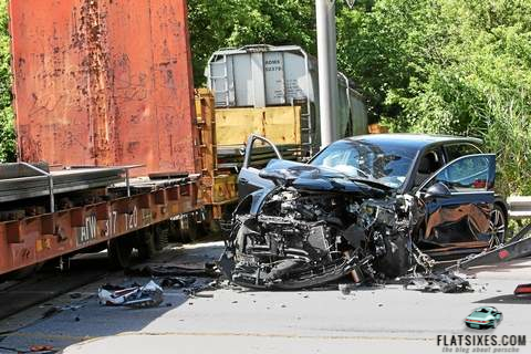 Porsche Cayenne hit by train
