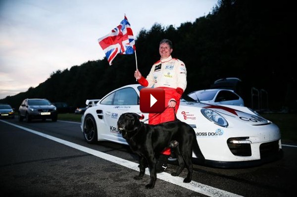 Mike Newman, holder of blind speed record, leaning against Porsche 911 GT2