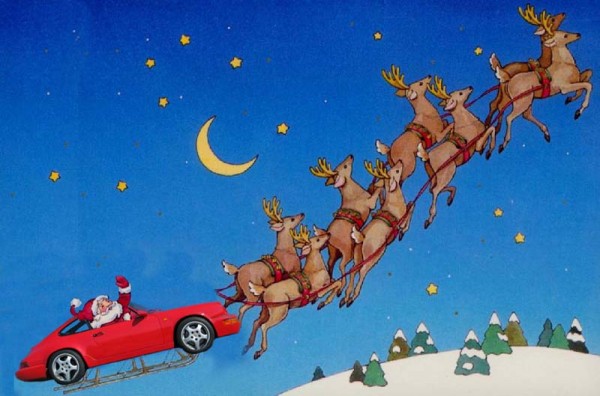 Porsche with santa in it being pulled by rheindeers