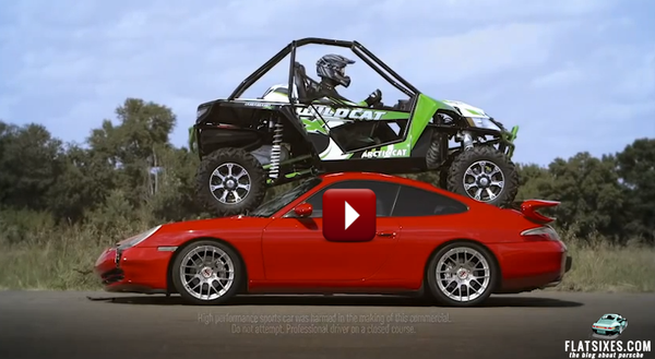 arctic cat driving over Porsche