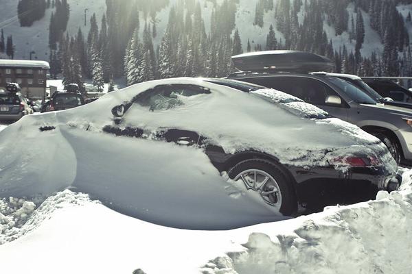 porsche 911 covered in snow