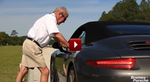 Hurley leaning on a Porsche 911 Cabriolet