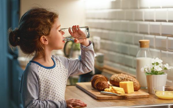 Healthy child drinking water