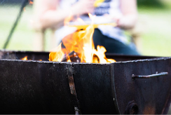 A flame ablaze inside a firepit
