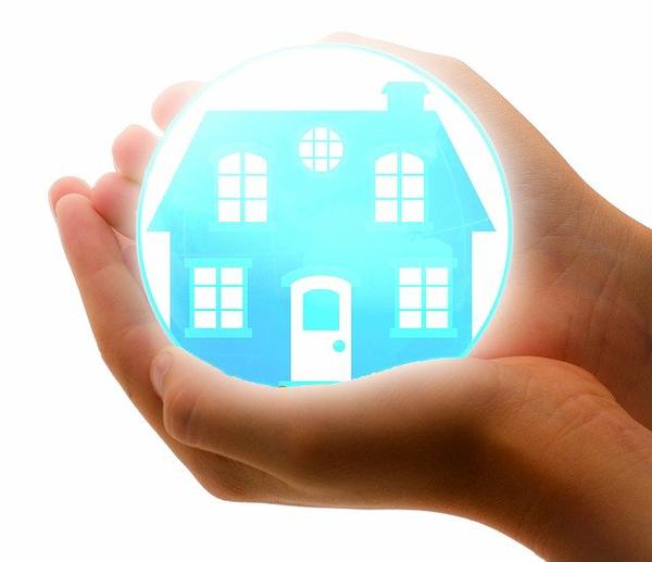 graphic showing hands holding illuminated house