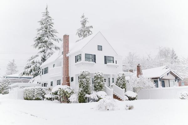 house and hard covered in snow