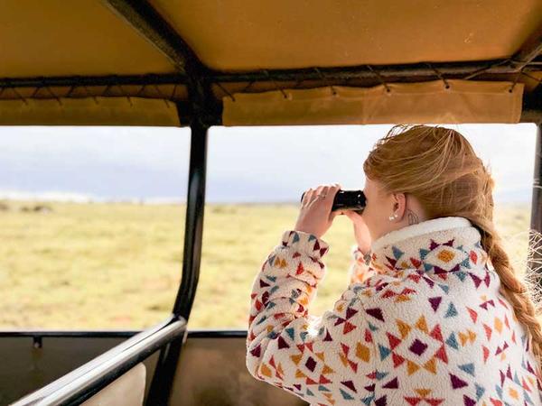 Little girl overlooked the reserve from safari vehicle