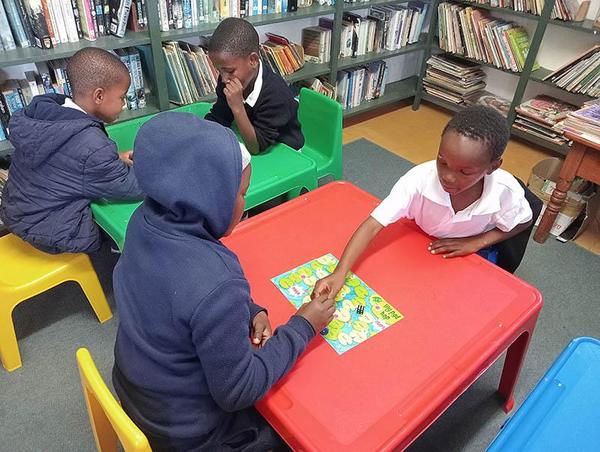 Young learners at kids tables doing educational exercises