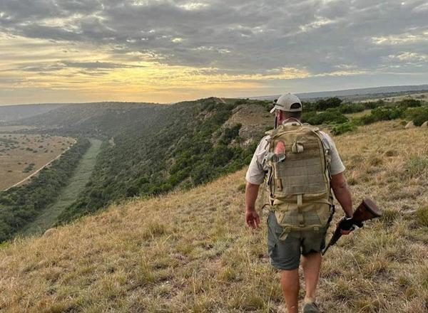 Man walking through reserve on foot