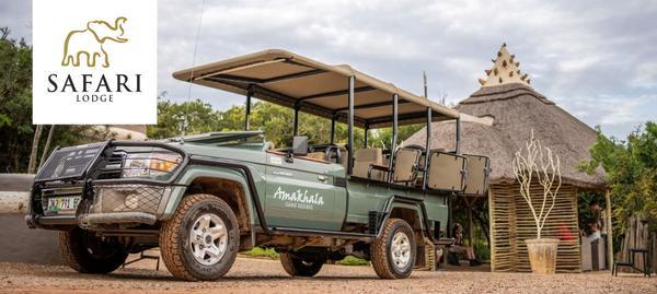 Dusty ranger vehicle parked outside lodge
