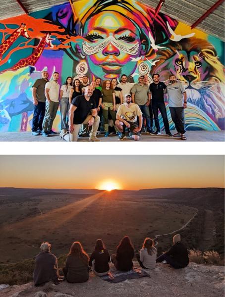 Group of guests enjoying the reserve, standing in front of artwork