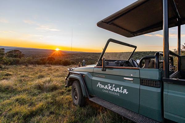 Game vehicle overlooking sunset