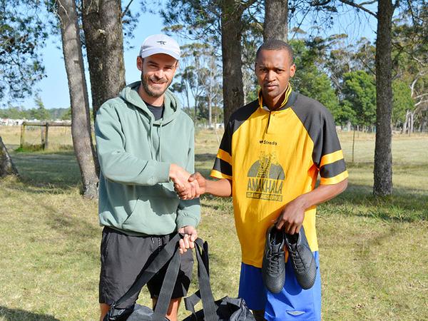 Hand over of sponsored soccer boots and kit bag