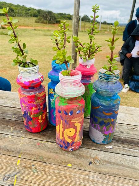 Spekboom cuttings planted into hand painted bottles