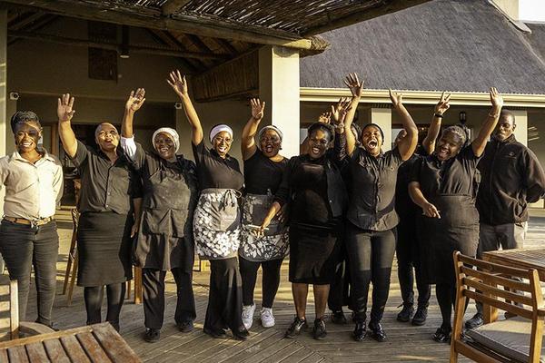 Staff in front of lodge