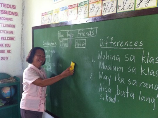 teacher from Tanza Elementary school using their new blackboard