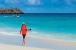 Description - Guest walking sanding beach, Gardner Bay, Espanola Island, Galapagos National Park, Galapagos Islands, Ecuador. Copyright © Ralph Lee Hopkins