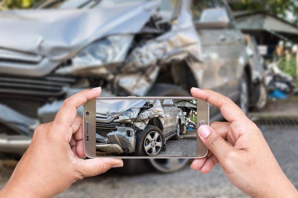 Photographing the scene of a car accident.