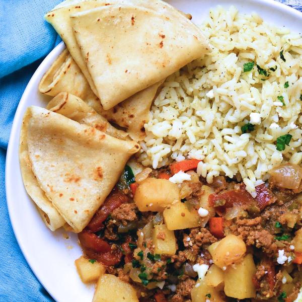 Mexican Picadillo served with cilantro lime rice and fresh corn tortillas