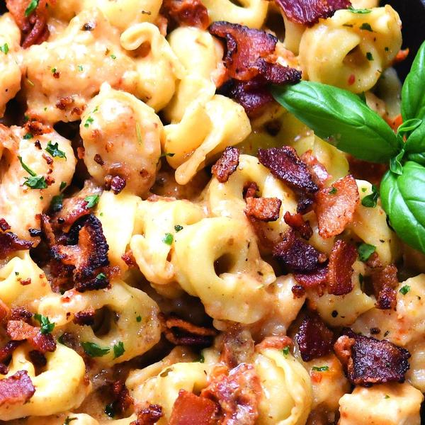 closeup of marry me chicken with pasta and bacon