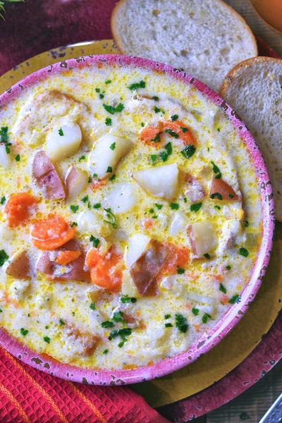 red pottery bowl with red potato and carrot soup