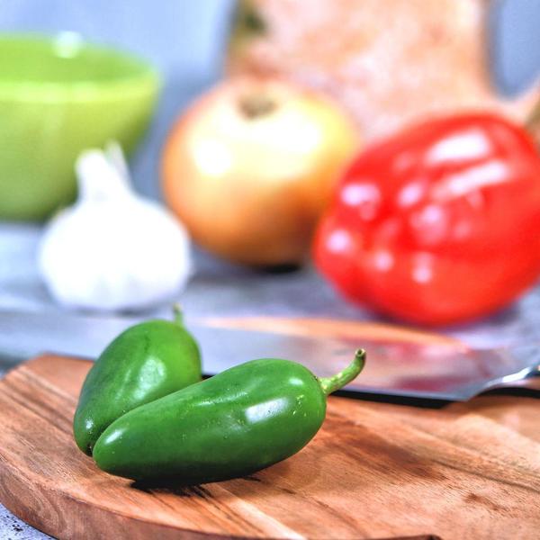 peppers and onions on a cutting board