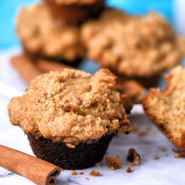 closeup of cinnamon pecan mini muffins with cinnamon sticks