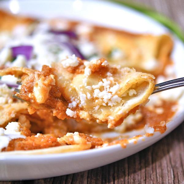 closeup of cheese entomatadas on a fork