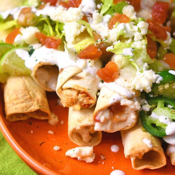 loaded chicken rolled tacos closeup