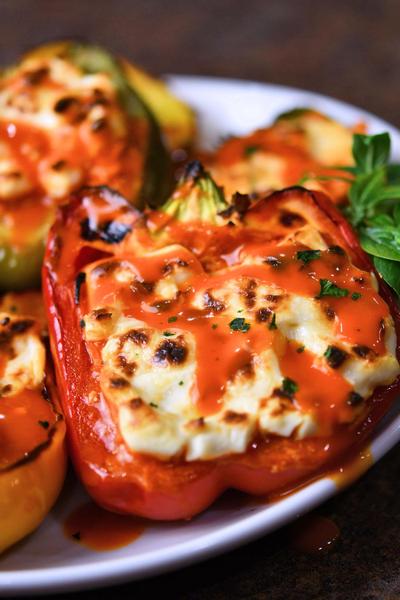 buffalo chicken stuffed peppers on a white plate