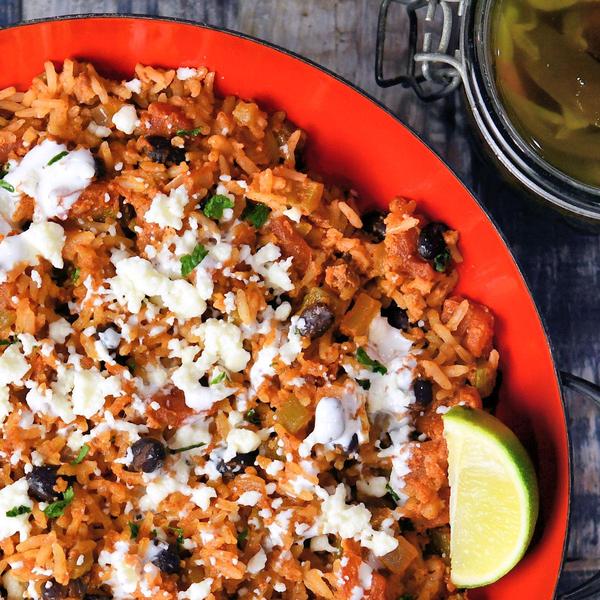 chorizo and rice in a red skillet