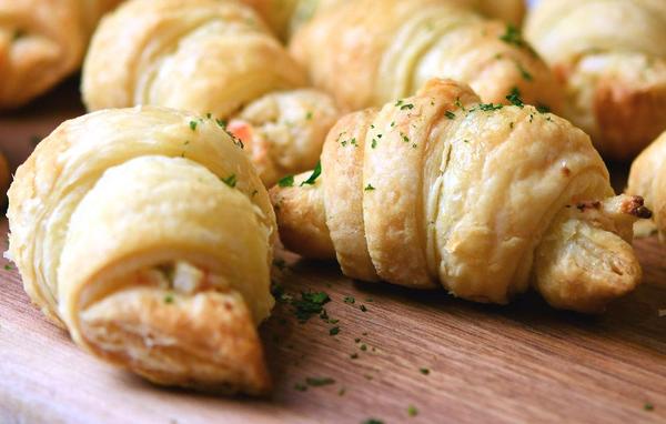 crab rangoon crescent rolls on a cutting board