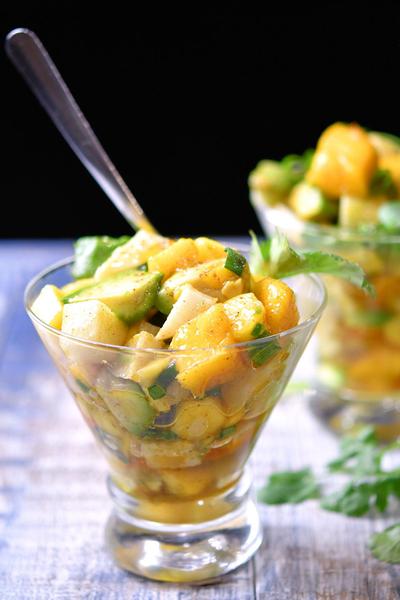 mango avocado and jicama salad in a decorate glass