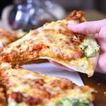 once slice of lasagna pizza lifted from cutting board