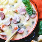 gnocchi and sausage soup in orange ceramic bowl