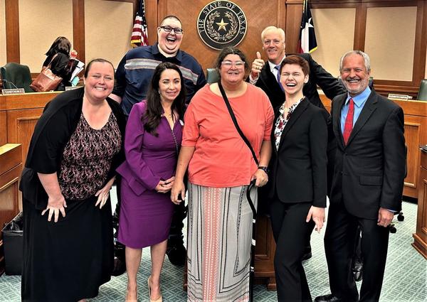 Pictured: Front: Brooke Hohfeld, Bill author Rep. Liz Campos, Cindy Whitaker, Lauren Gerken, Dennis Borel; Back, the tall guys, Jordan Smelley, Chairman
James Frank