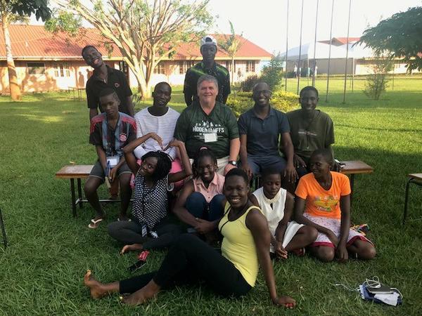 Paul Pulford surrounded by students on his mission trip to Kampala, Uganda