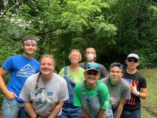 Christie (center) surrounded by her volunteer work team in Harlan, Kentucky