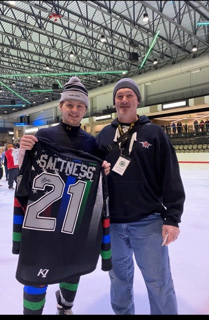 Dr. Richard Rattay with a player during a charity jersey night
