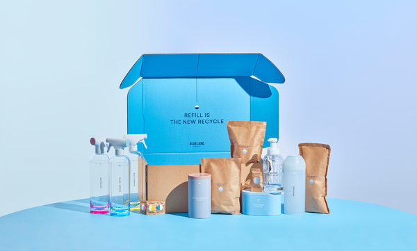 A blueland box with various products in front