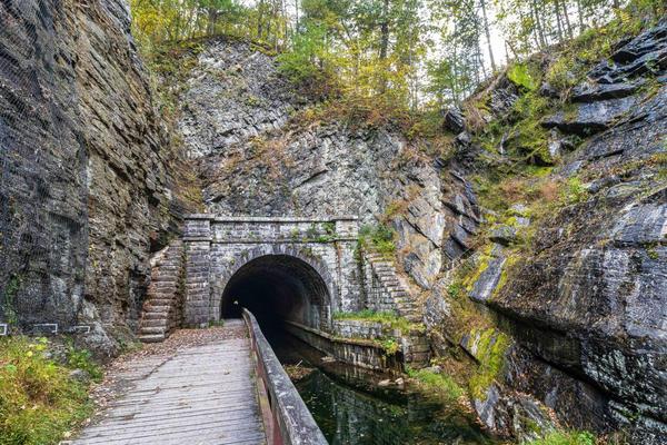 a tunnel on the side of a mountain