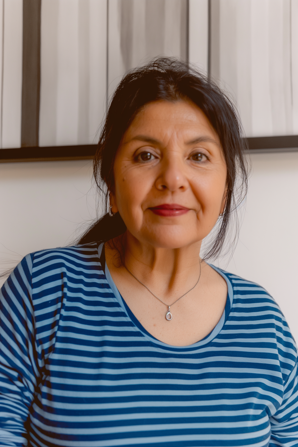 Confident, healthy middle-aged woman smiling, shown from the waist up