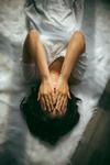 Women in bed frustrated by her sexual dysfunction
