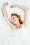 Woman waking from a good night's sleep