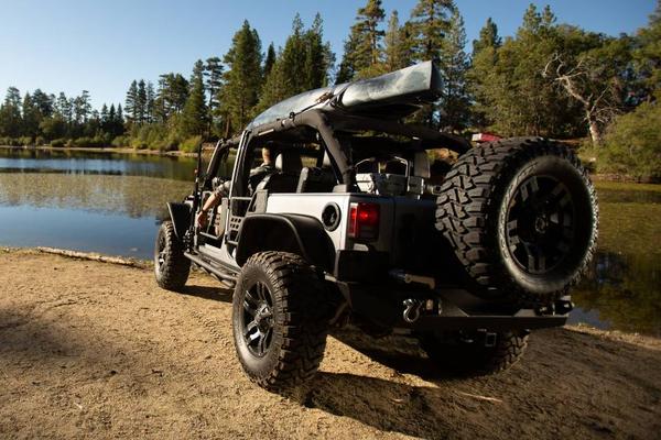 Jeep with camping gear and kayak rack