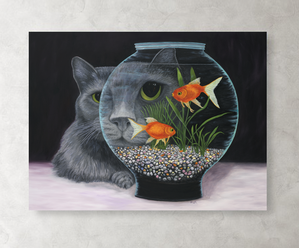 Gray long haired cat looking into a fishbowl with colorful pebbles.