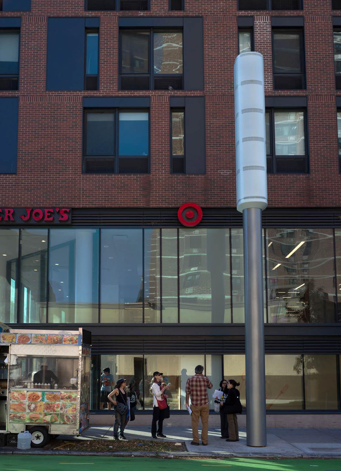 A group of people walking in front of a building
                                                                        
                                                                        Description automatically generated with medium confidence