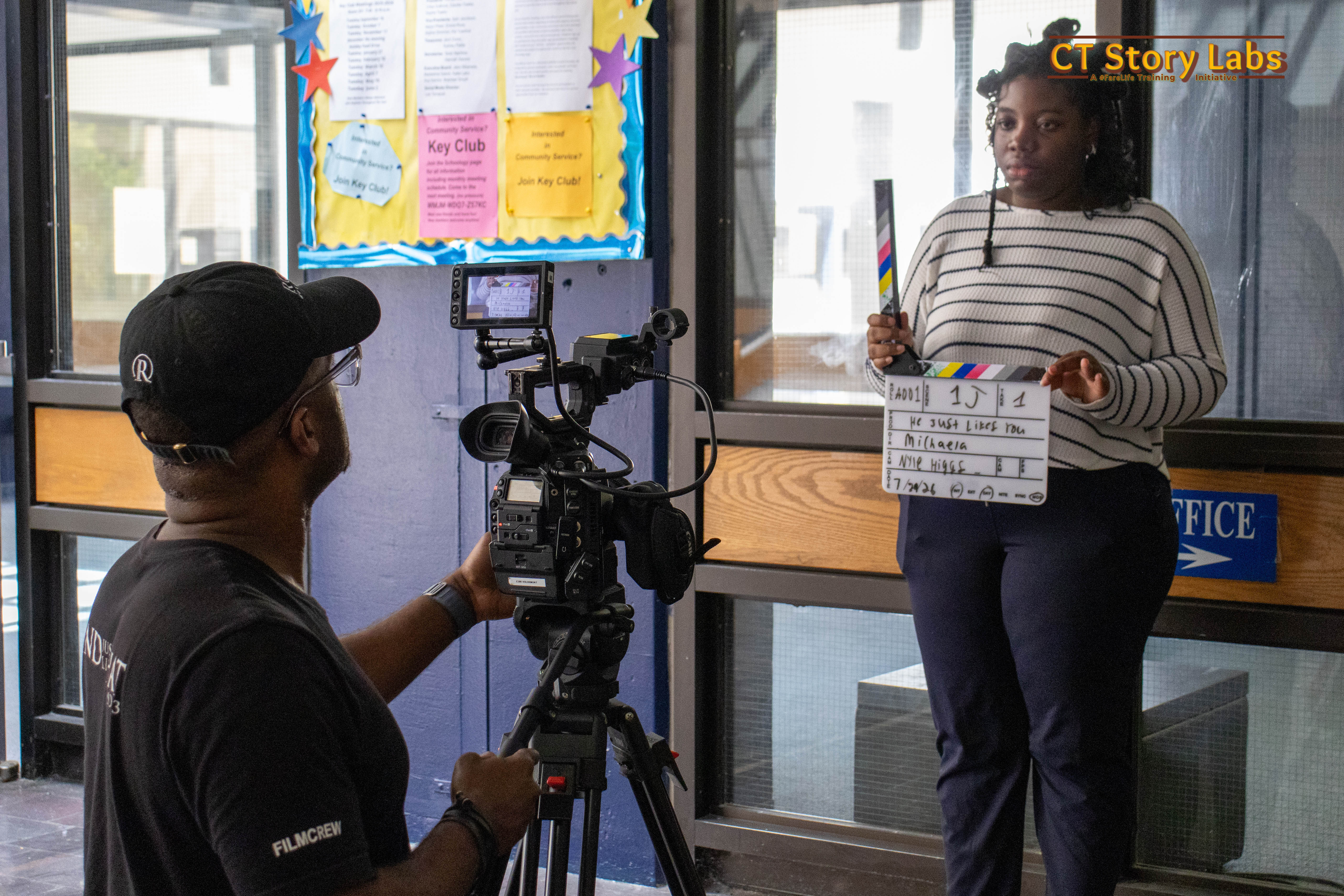 A DP films an actress holding the slate at the start of a take on a CT Story Labs set