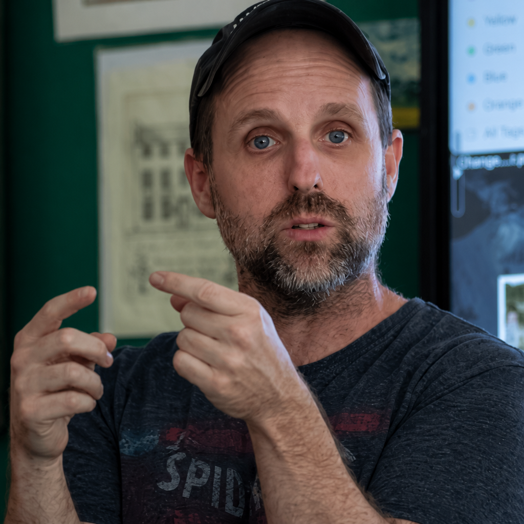 Brian Hogan speaking and gesturing during a live workshop