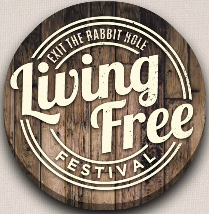 A round wooden sign with white text
                        
                        Description automatically generated